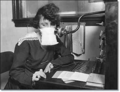 (Original Caption) Flu epidemic, 1918: Telephone operater with protective gauze.